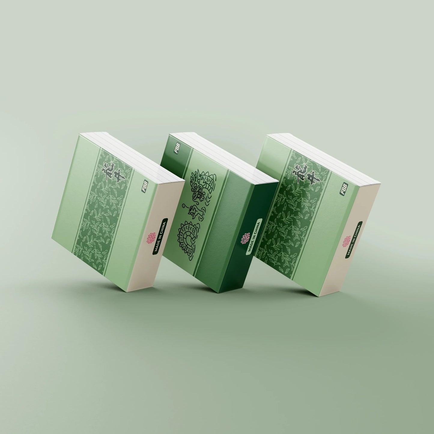 Green keycap packaging boxes with illustrated panels and a small pink logo mark