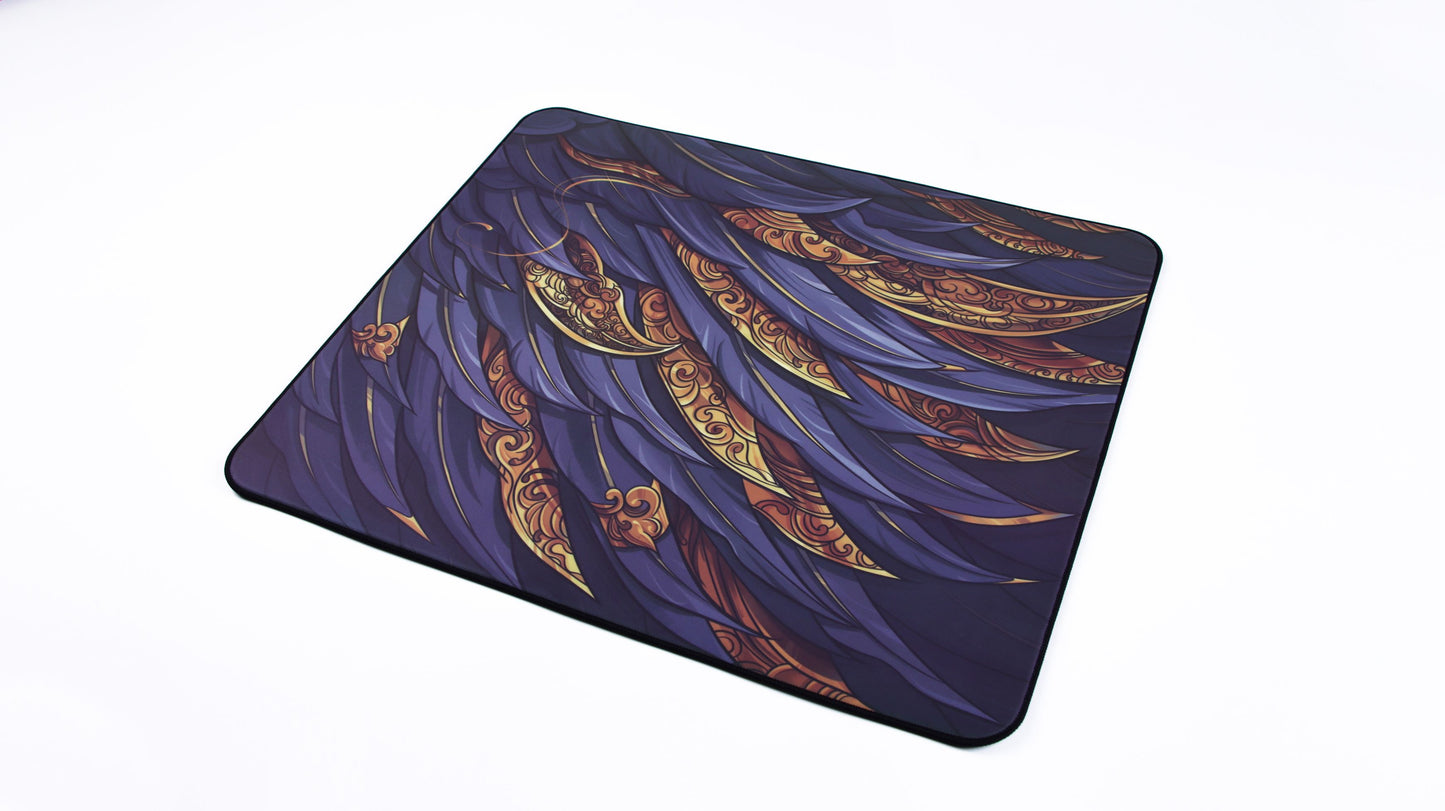 Square gaming mouse pad with deep blue and gold curved feather pattern