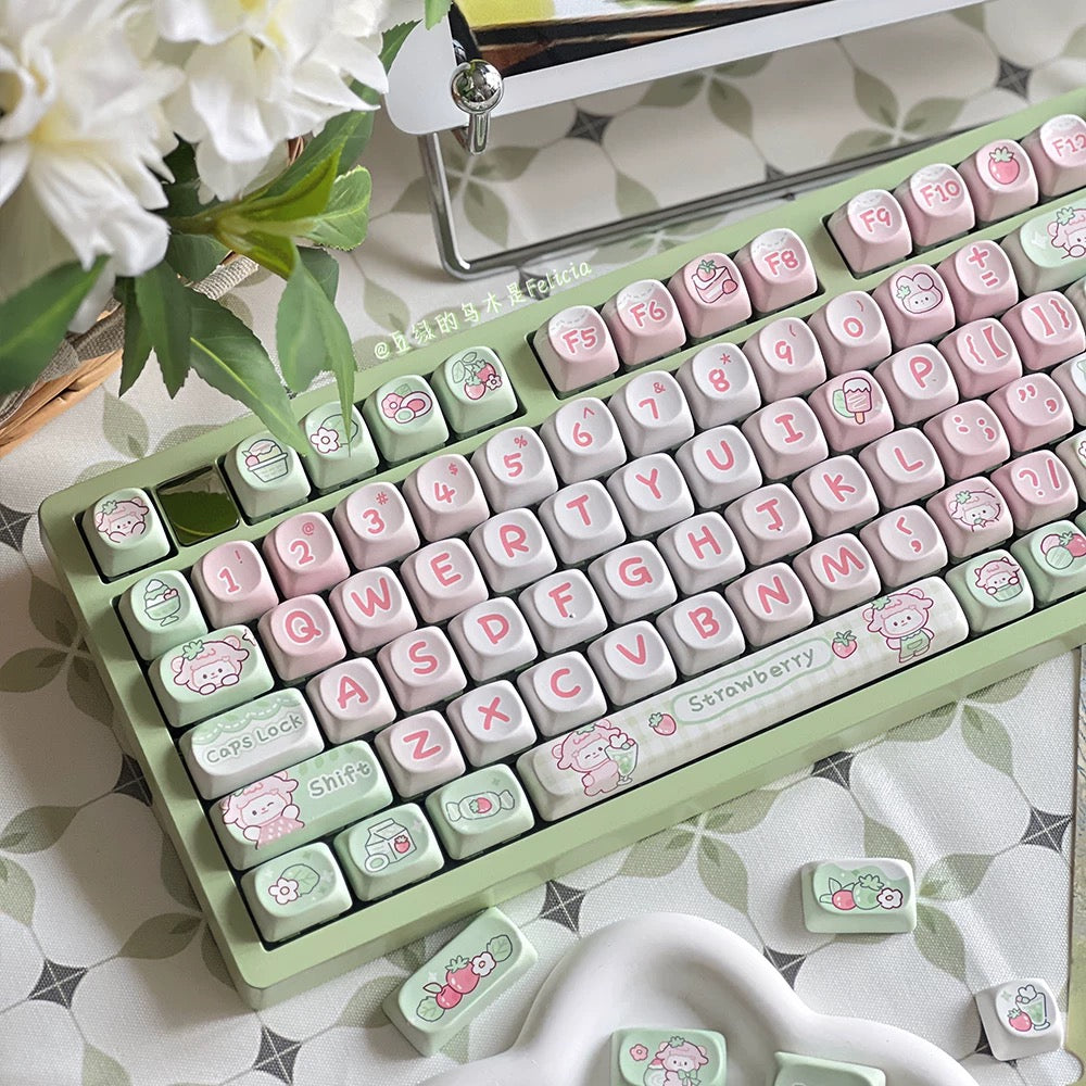 Mint-green keyboard and strawberry-themed keycaps with pink heart and enter caps
