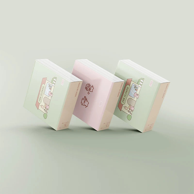 Three pastel keycap boxes with flower and cupcake graphics