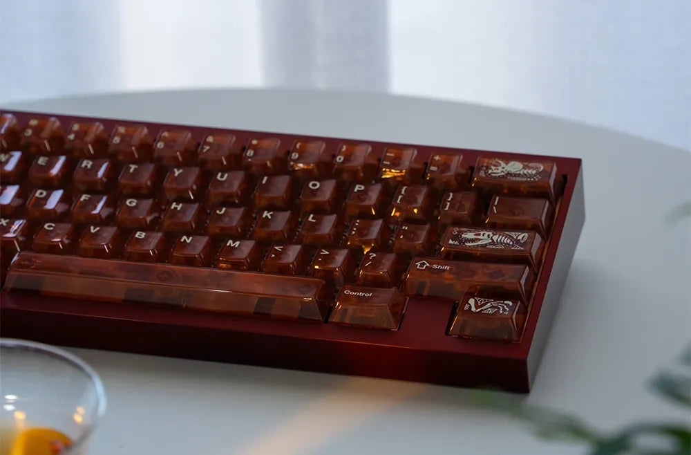 Amber translucent keycap set close-up, function row and escape key visible