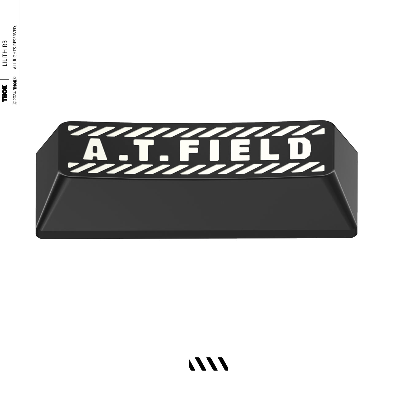 Black spacebar keycap with A.T. FIELD lettering and striped top