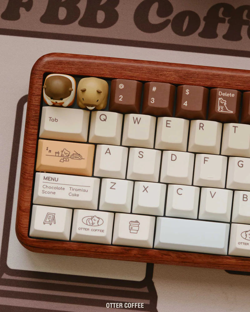 Close-up of brown and white keycaps with symbols on a wooden keyboard frame