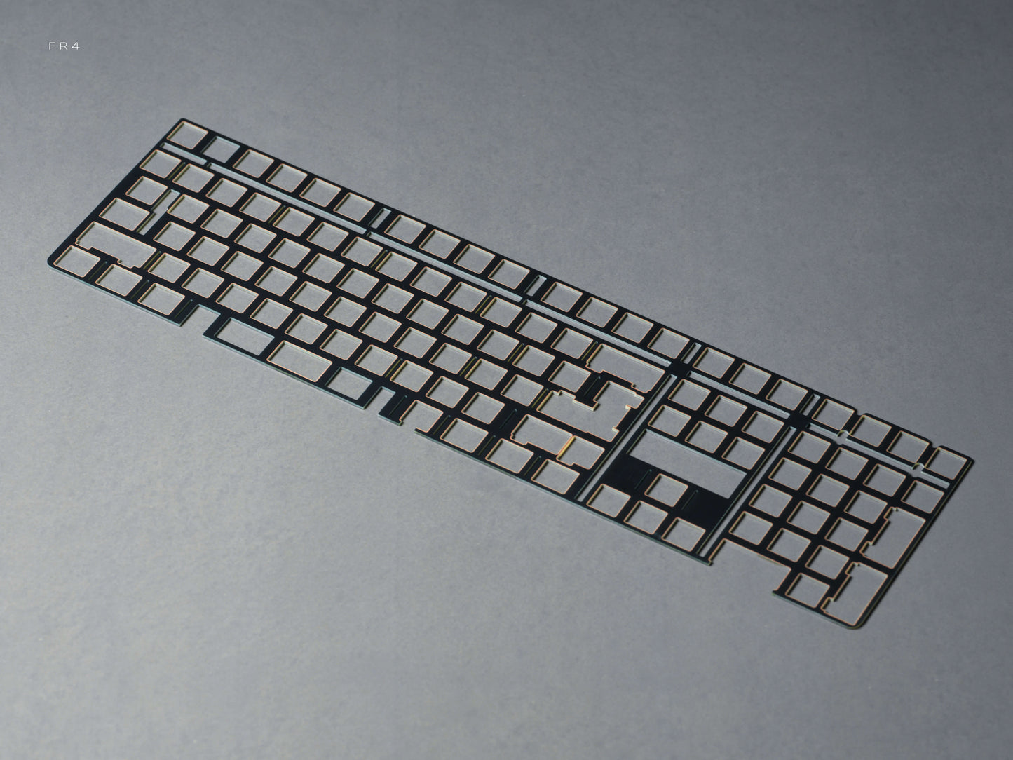 FR4 keyboard plate add-on with dark grid cutouts and large center opening