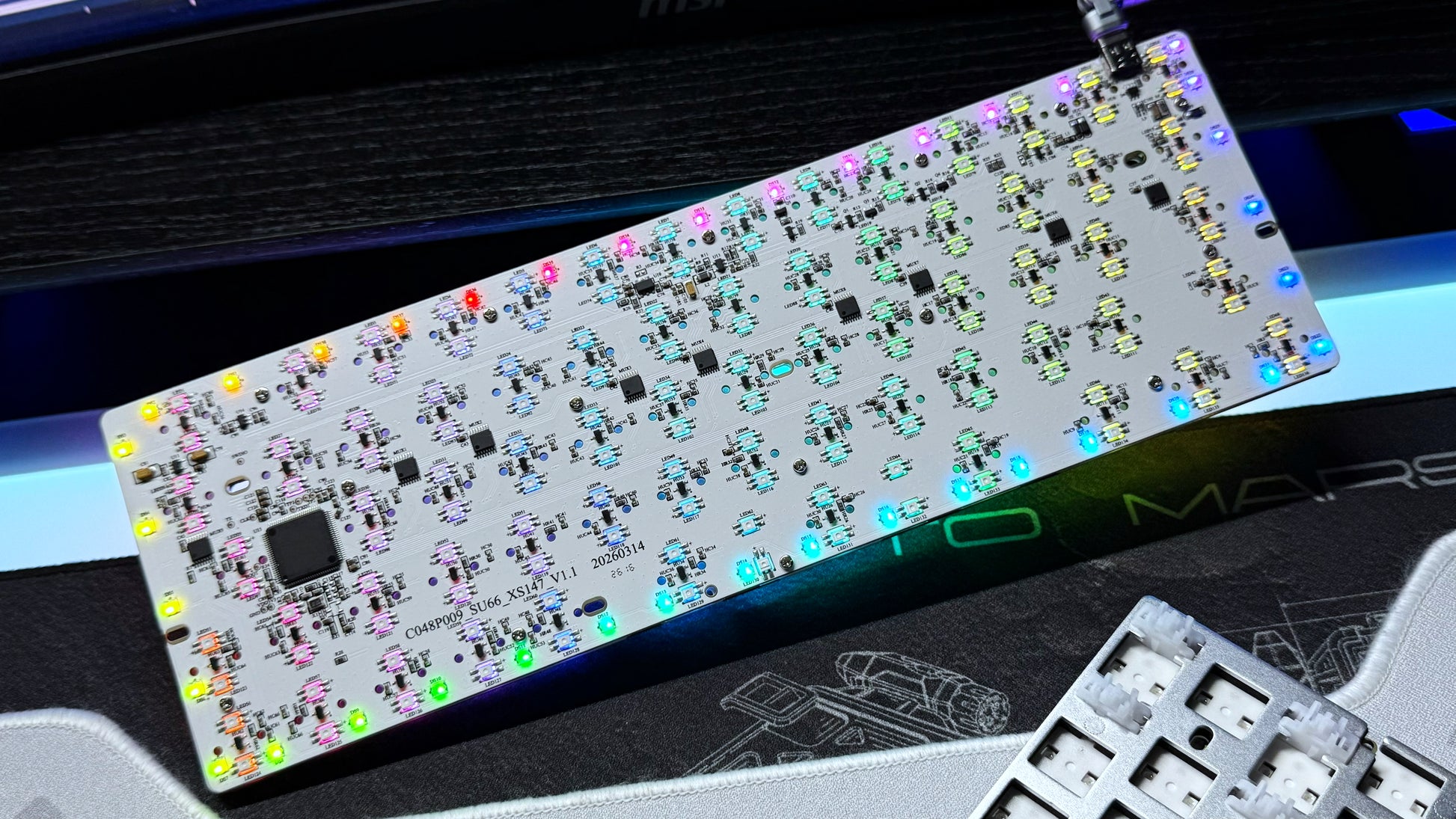 PCB module with dense electronics layout and colorful LED component rows