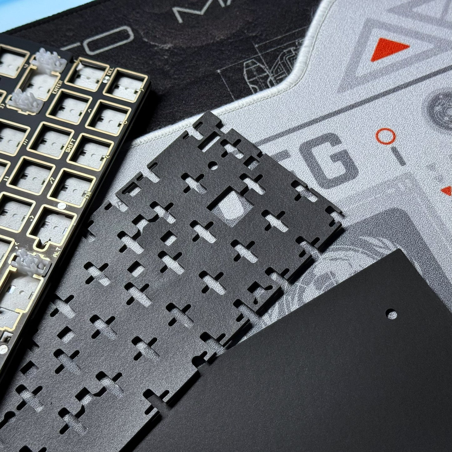 PCB module close-up with black chip socket grid on a gray board