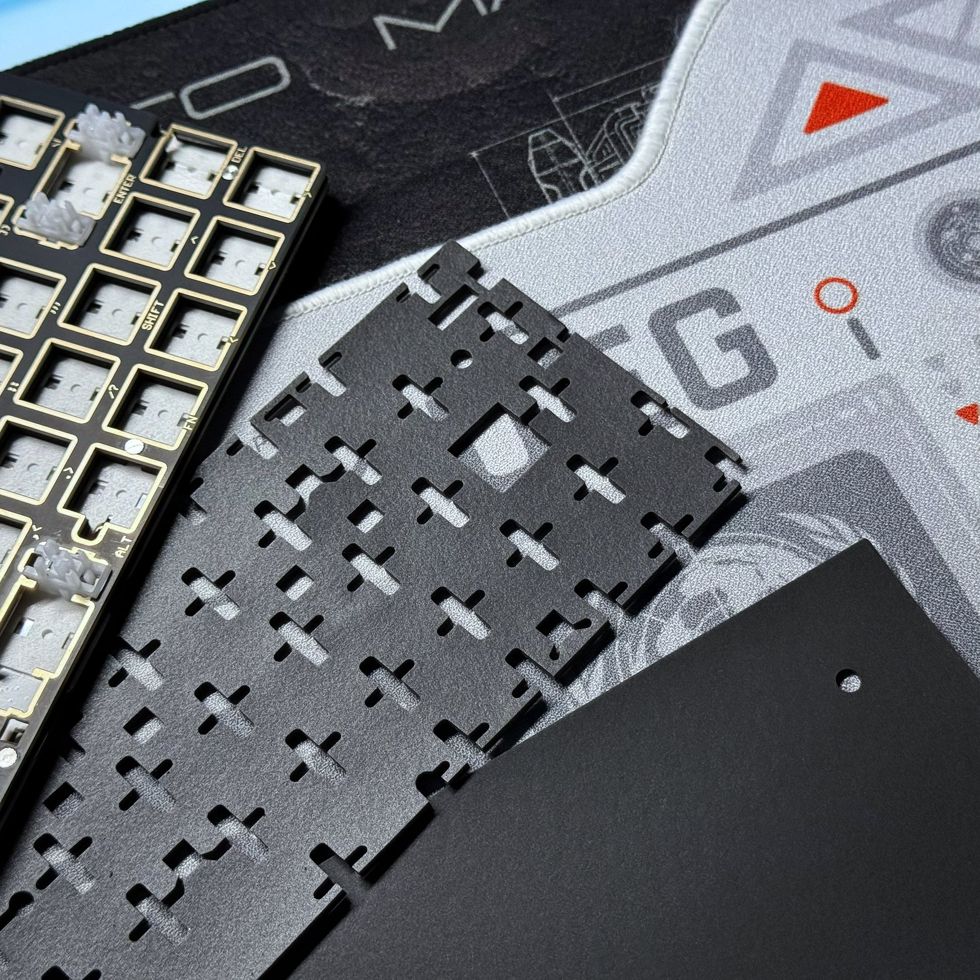 PCB module close-up with black chip socket grid on a gray board