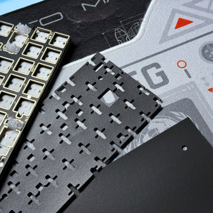 PCB module close-up with black chip socket grid on a gray board