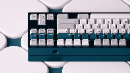 Mechanical keyboard keycap set close-up with white keys and teal accents