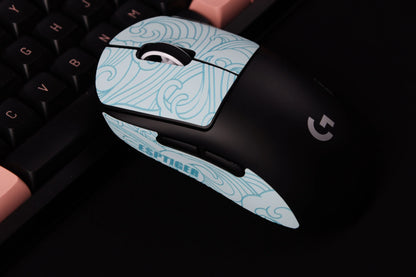 Blue grip tape applied to gaming mouse with swirl design
