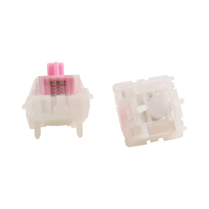 Keyboard switch front and rear views, clear housing with pink spring insert