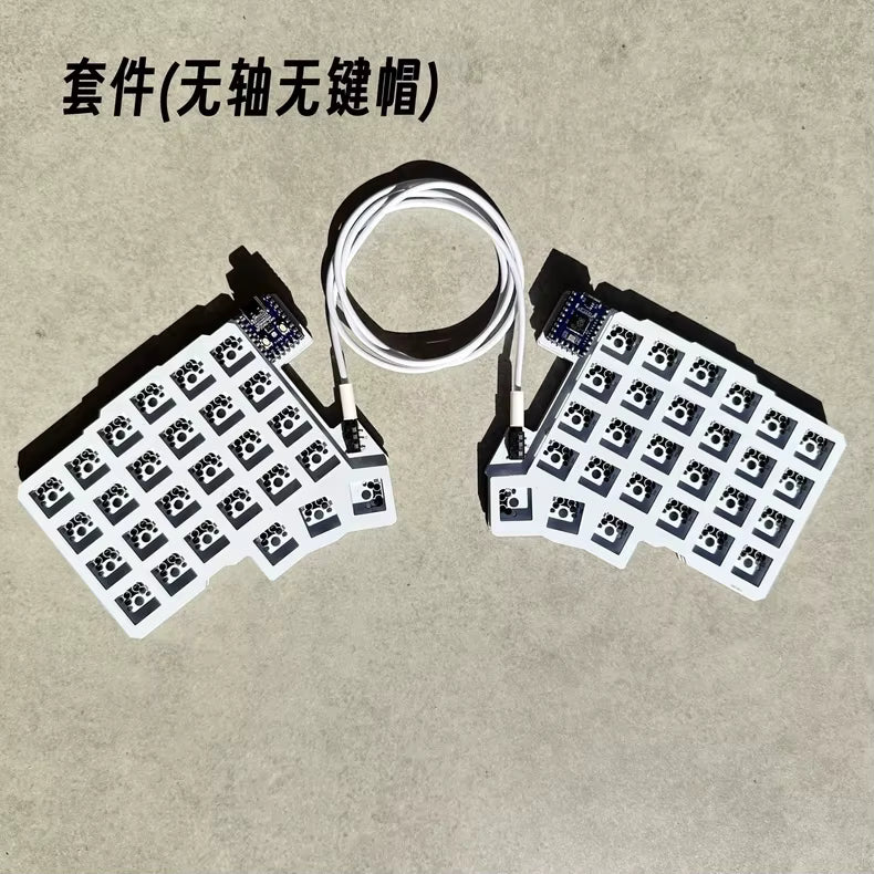 Black split wired keyboard PCB with two halves and connecting ribbon cable