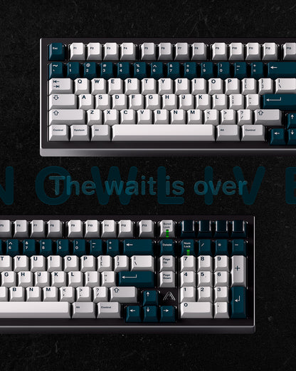Teal and white mechanical keyboard keycap set with close key view on dark base