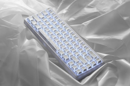 White prism forged carbon keycaps with blue glow through translucent legends