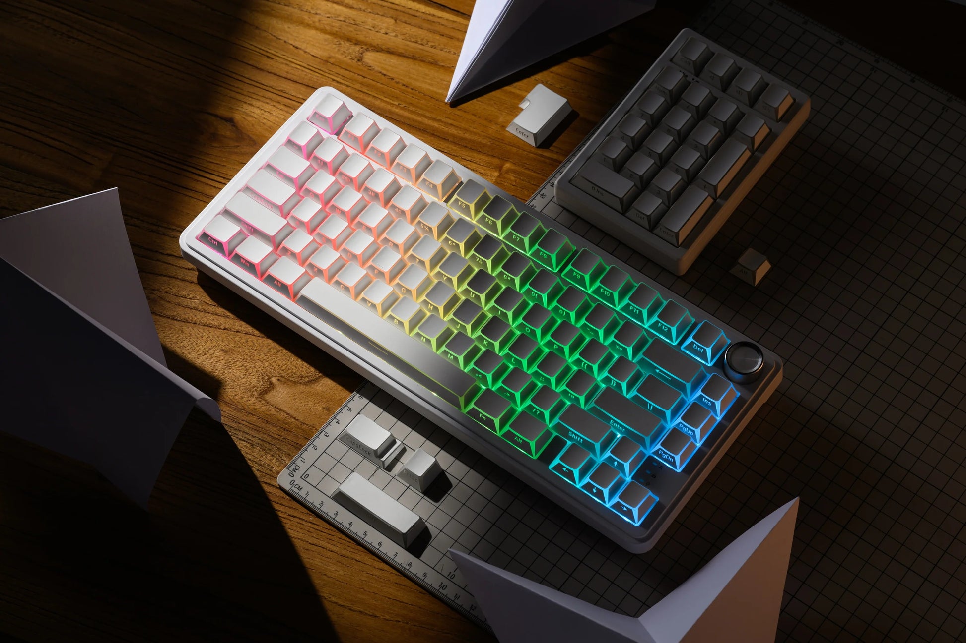 RGB-backlit Prism Shadow keycap set with green and blue glowing geometric accents