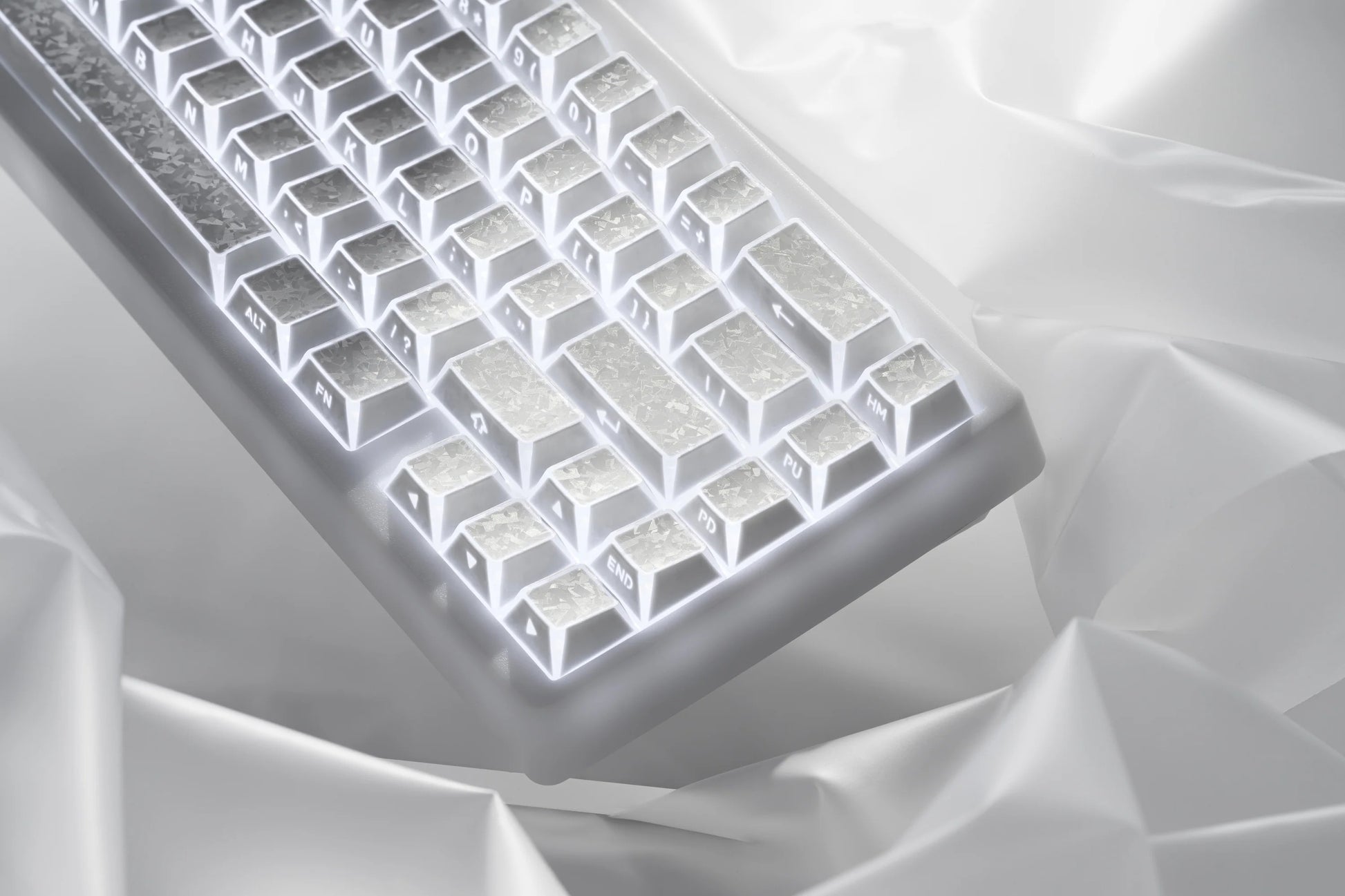 Close-up of prism forged carbon keycaps with illuminated white legends