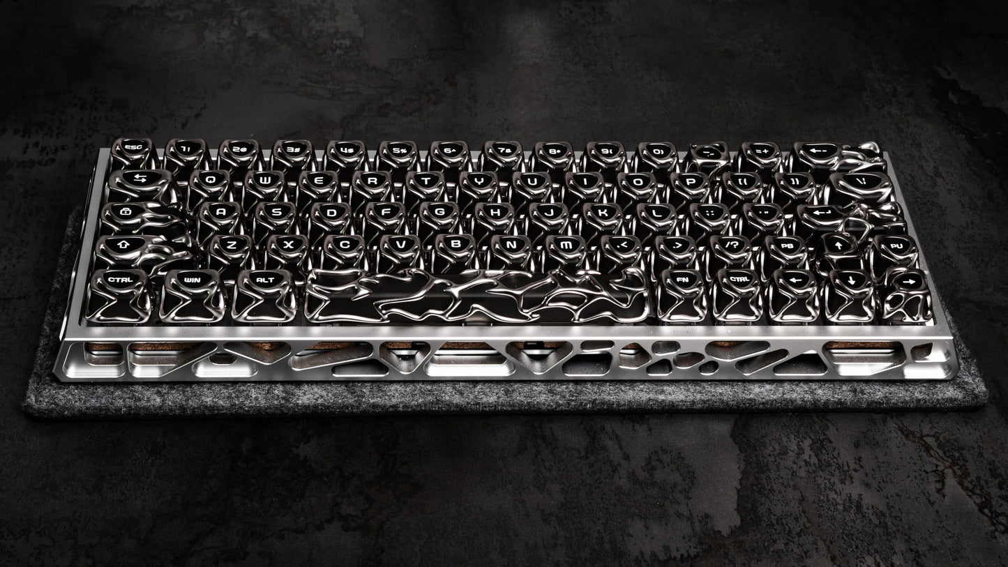 Full keyboard keycap layout in glossy black and silver, on textured pad