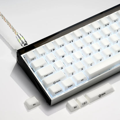Mechanical keyboard with white keycaps in a black case tray and visible lettering keys