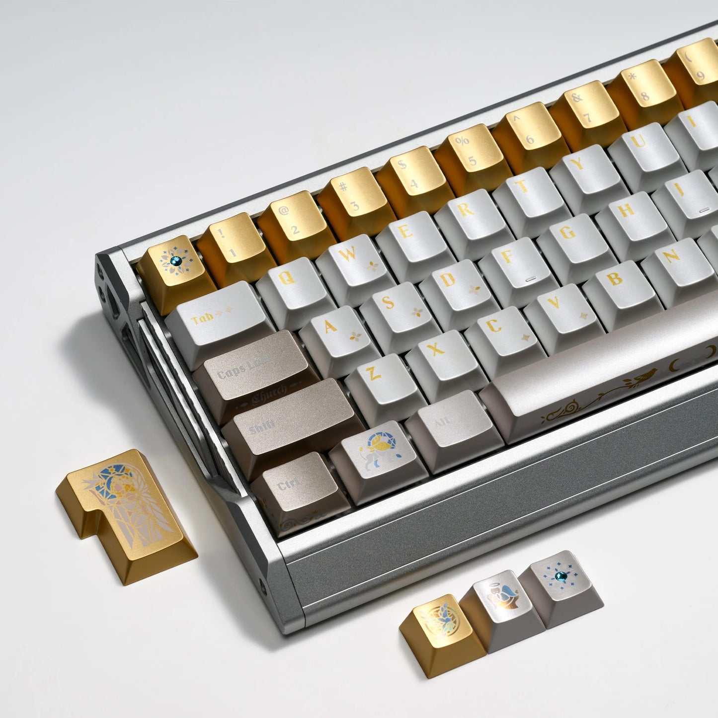 Stained-glass style keyboard keycaps on a frame, alternating gold and silver keycaps