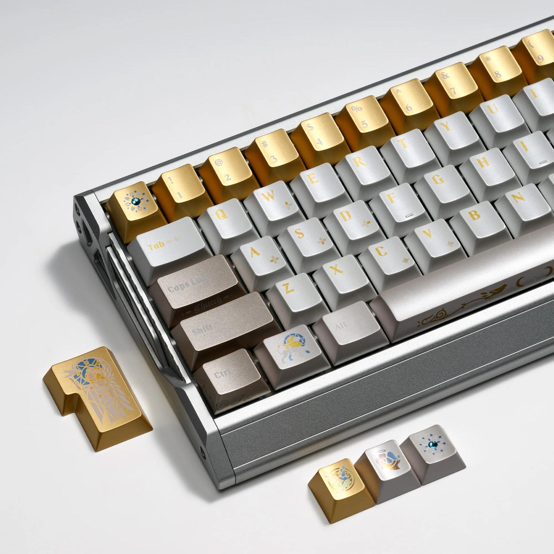 Stained-glass style keyboard keycaps on a frame, alternating gold and silver keycaps