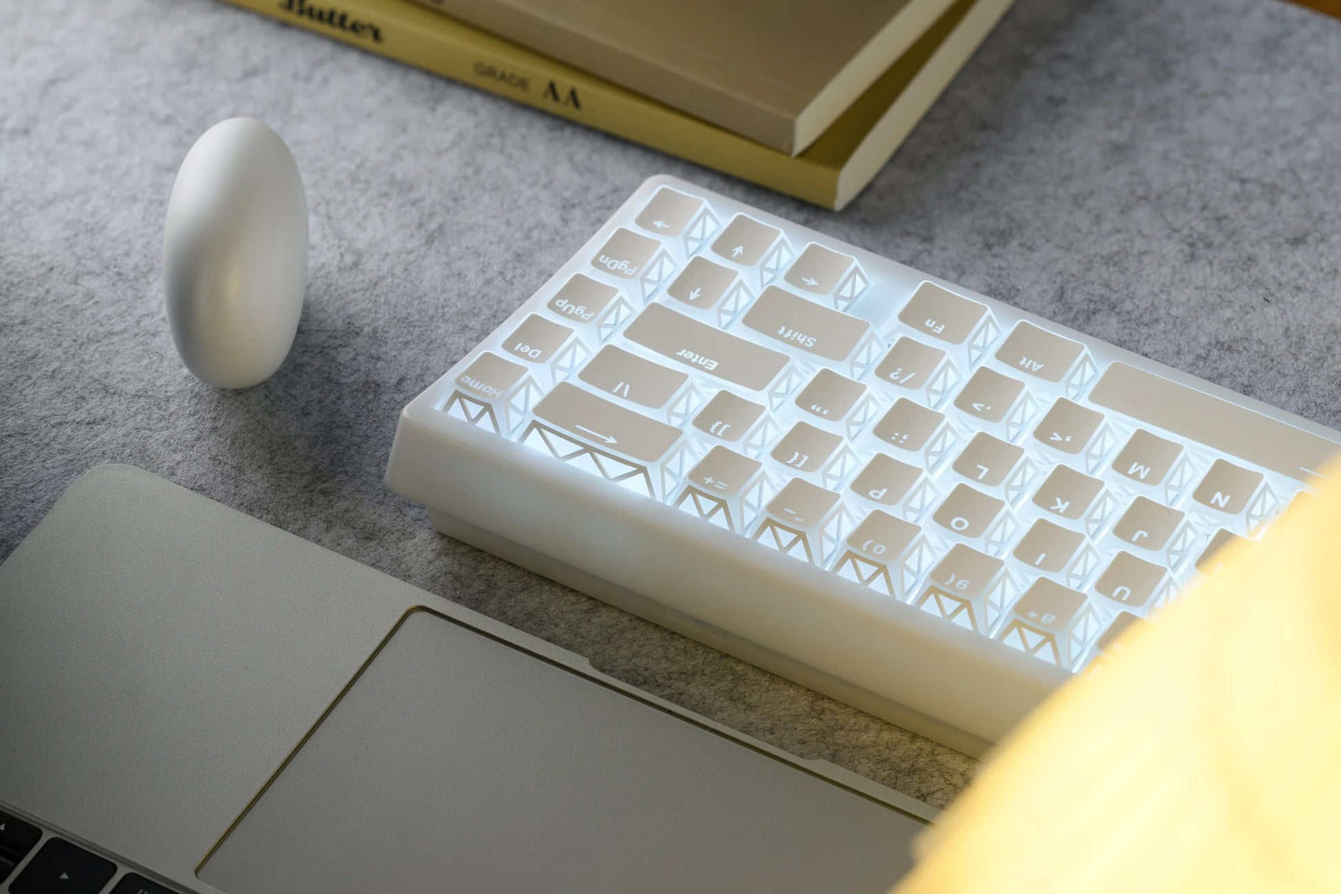 White prism refraction keyboard with sculpted keycaps and palm rest
