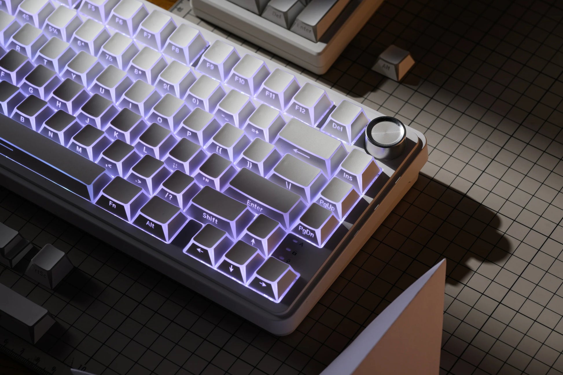 Light Prism Shadow keycap set with purple-blue backlit geometric pattern