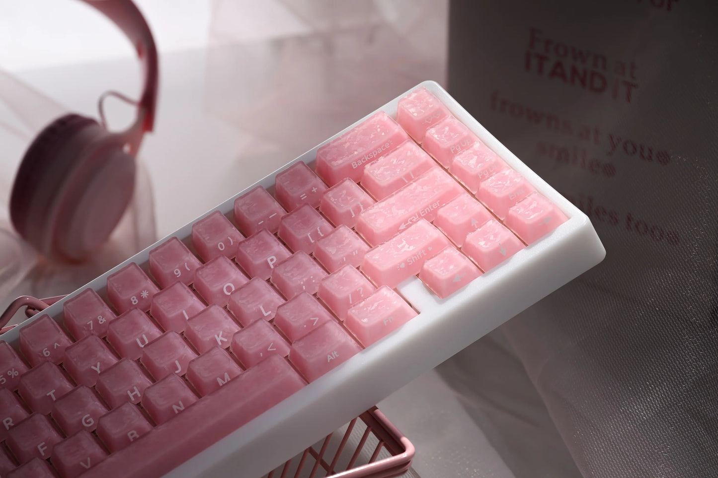 Pink mechanical keyboard keycaps with glossy stepped profiles