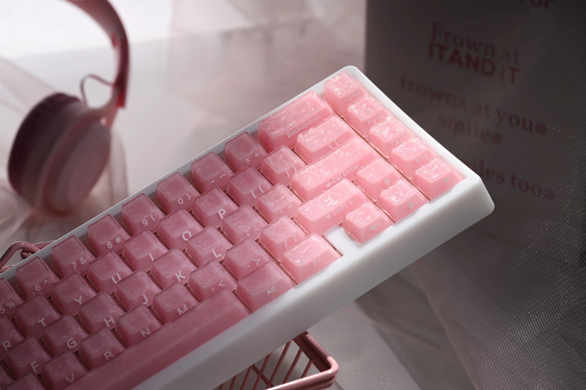 Pink mechanical keyboard keycaps with glossy stepped profiles