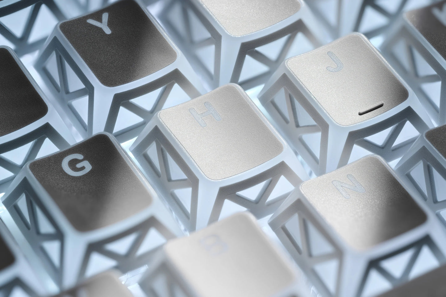 White prism refraction keyboard keys with sculpted shapes and letter legends