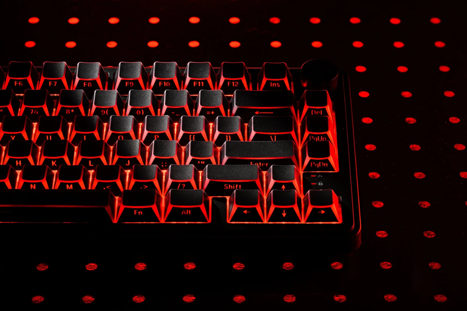 Dark Prism Shadow keycap set with strong red backlit geometric pattern
