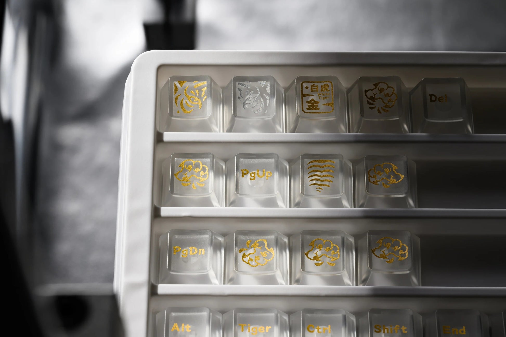 Keycap tray with multicolor legends and gold-accented square keycaps