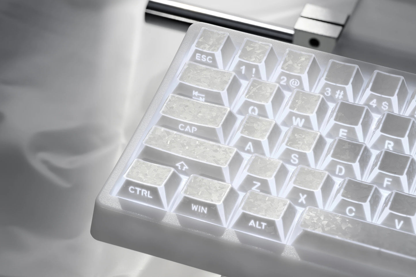 Prism forged carbon keyboard keycaps showing Esc, Ctrl, Alt, and character legends