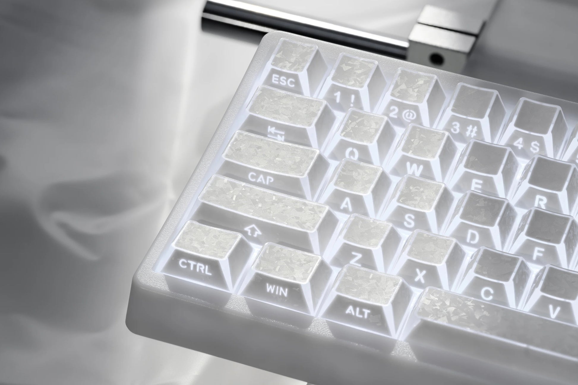 Prism forged carbon keyboard keycaps showing Esc, Ctrl, Alt, and character legends