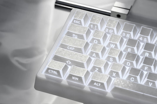Prism forged carbon keyboard keycaps showing Esc, Ctrl, Alt, and character legends