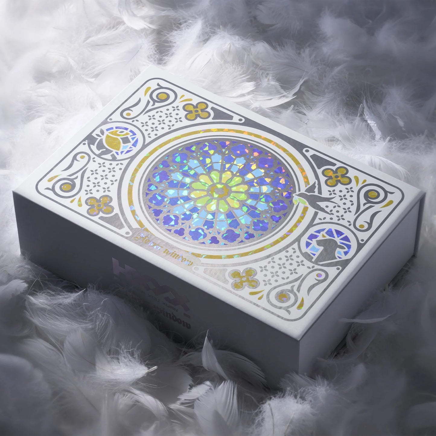 Stained-glass style boxed keycap set with a colorful circular window graphic