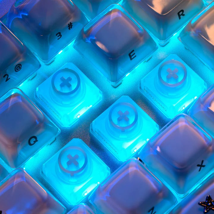 Blue backlit keyboard switches with white cross stem, close-up