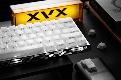 White mechanical keyboard keycaps with visible English legends and function keys