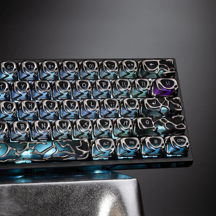 Keyboard keycap set in blue-tinted lighting, black and silver caps
