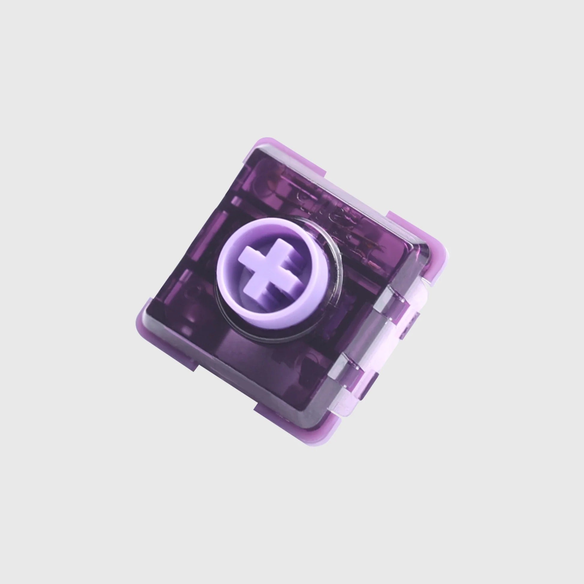 Low profile mechanical key switch with dark purple transparent housing and pale purple stem