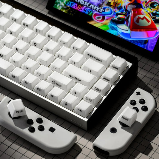 Mechanical keyboard with white keycaps and right-side media controls on a controller dock
