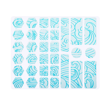 Blue grip tape pieces on backing sheet with swirl pattern
